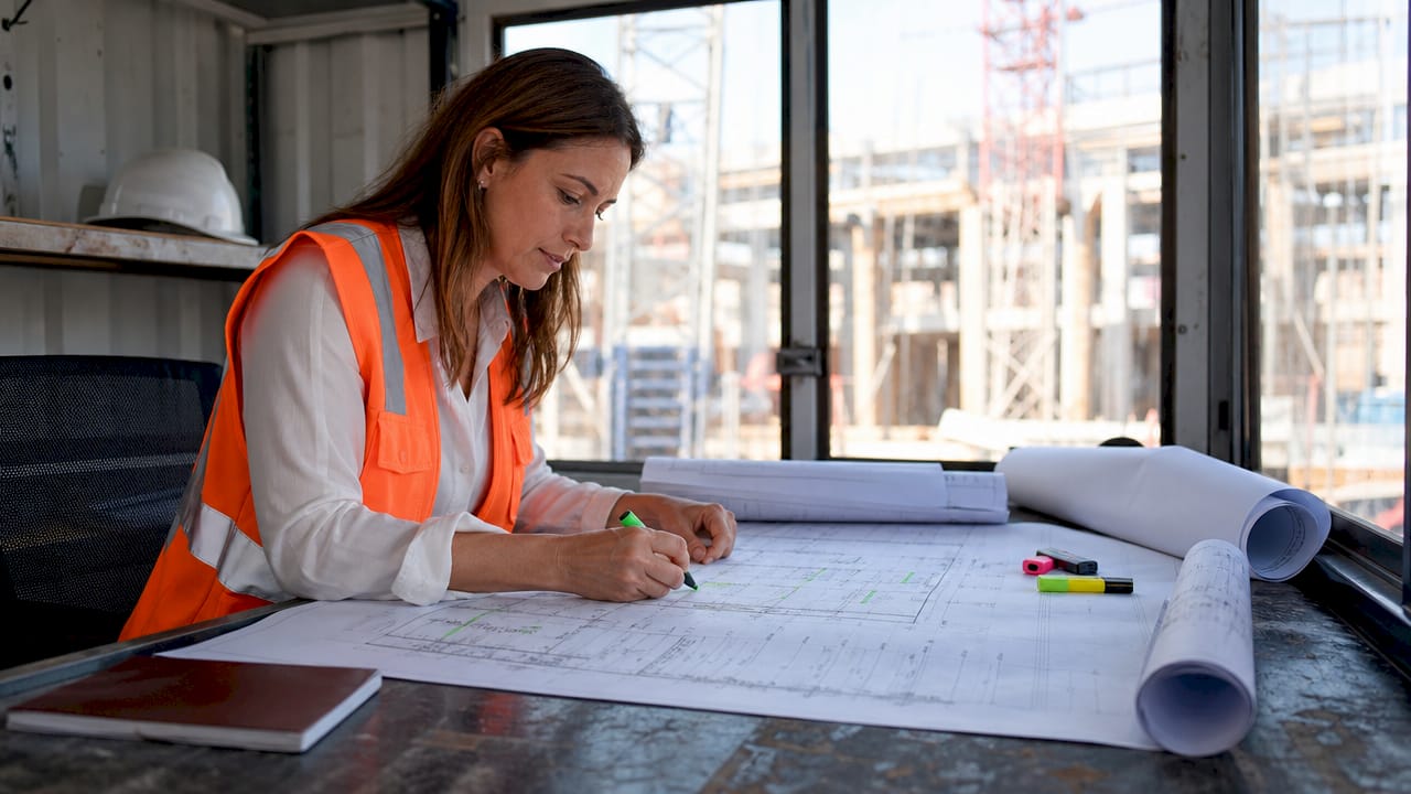 Project manager reviewing construction risk plans