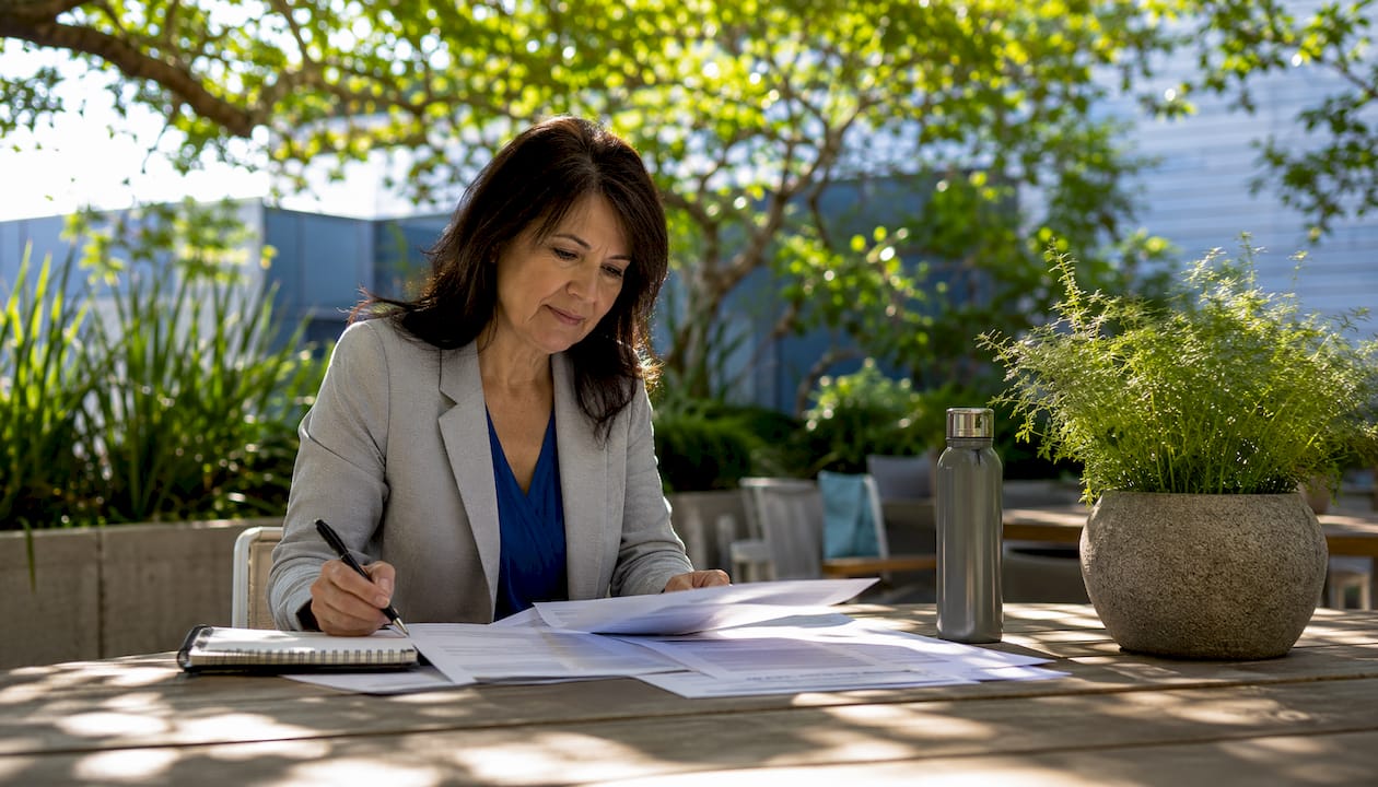 Lead auditor reviewing safety audit documents at conference table