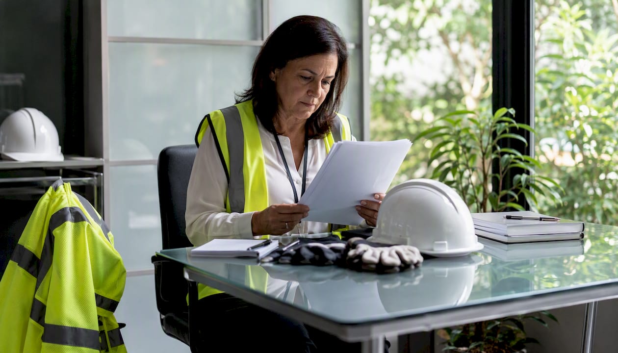 Safety officer reviewing emergency procedure documents